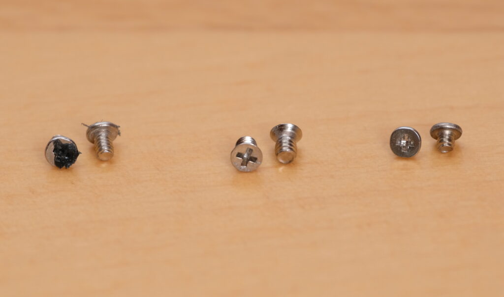 Screws that hold the circuit board of the Canon 350D in place.